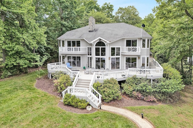 217 Anthony Home Rd, Huddleston, VA 24104 - back of property featuring a balcony, a yard, stairs, a chimney, and a deck
