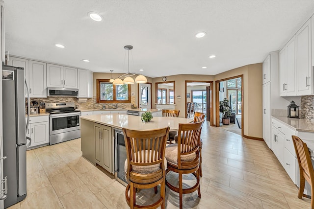217 Anthony Home Rd, Huddleston, VA 24104 - kitchen with appliances with stainless steel finishes, plenty of natural light, light countertops, and recessed lighting