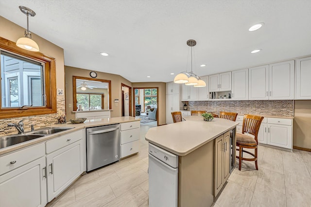 217 Anthony Home Rd, Huddleston, VA 24104 - kitchen with stainless steel dishwasher, a sink, tasteful backsplash, white cabinets, and recessed lighting