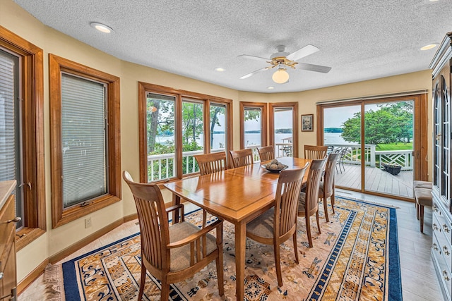 217 Anthony Home Rd, Huddleston, VA 24104 - dining space featuring healthy amount of natural light, a ceiling fan, a textured ceiling, recessed lighting, and a water view