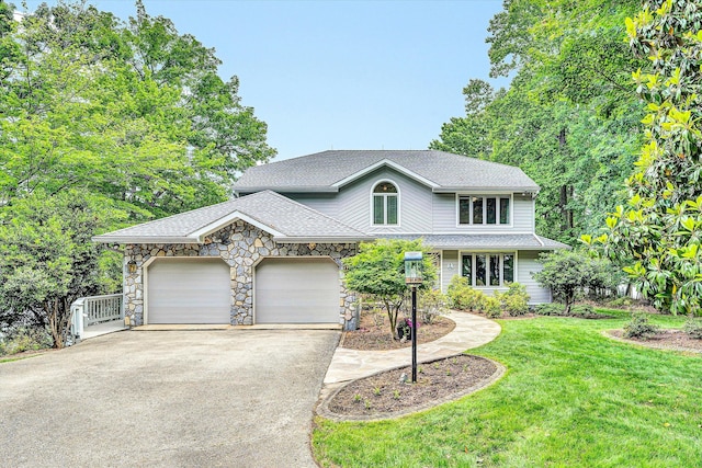 217 Anthony Home Rd, Huddleston, VA 24104 - traditional-style house featuring driveway, a front lawn, a shingled roof, an attached garage, and stone siding