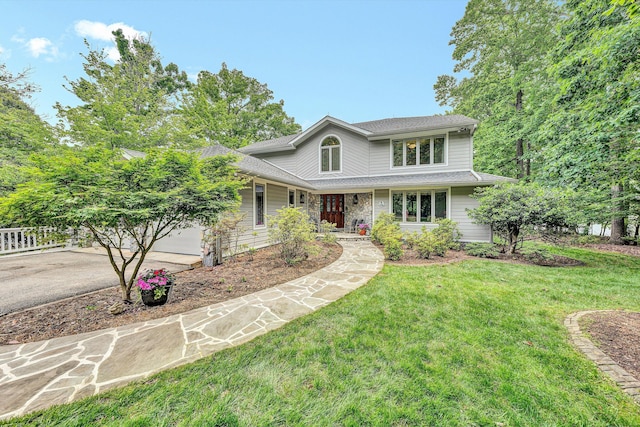 217 Anthony Home Rd, Huddleston, VA 24104 - traditional home featuring driveway, a front lawn, an attached garage, and roof with shingles