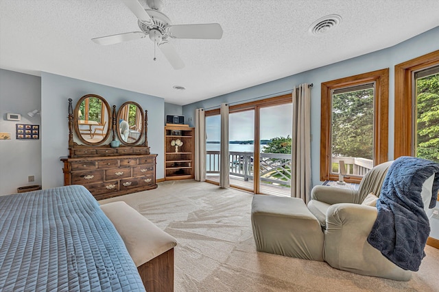 217 Anthony Home Rd, Huddleston, VA 24104 - carpeted bedroom featuring access to exterior, a textured ceiling, and ceiling fan