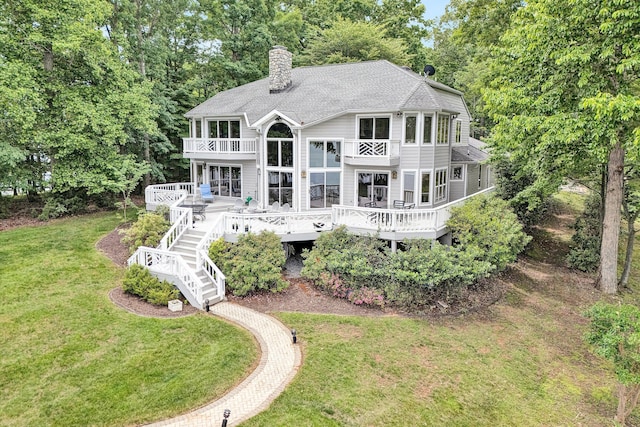 217 Anthony Home Rd, Huddleston, VA 24104 - back of property featuring a balcony, a chimney, a lawn, a deck, and stairway
