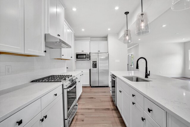 7036 Fairway Ridge Rd, Salem, VA 24153 - kitchen with stainless steel appliances, under cabinet range hood, a sink, recessed lighting, and white cabinetry