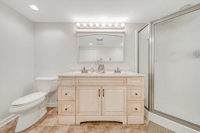 full bath with toilet, a shower stall, double vanity, and baseboards