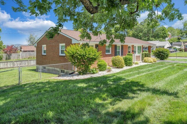 single story home featuring brick siding