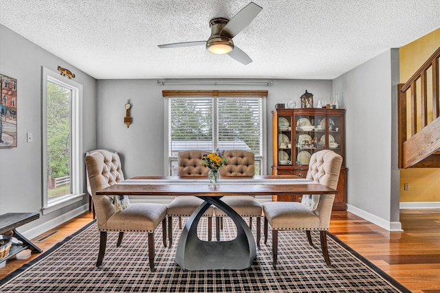 145 W Arrowhead Ct, Troutville, VA 24175 - dining room with light wood finished floors, a ceiling fan, a textured ceiling, and baseboards