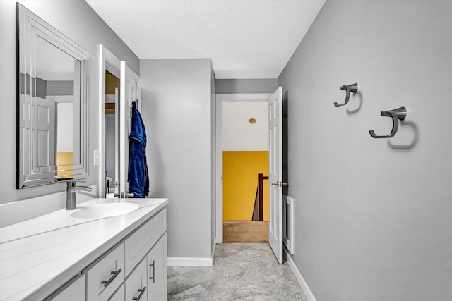 145 W Arrowhead Ct, Troutville, VA 24175 - bathroom with baseboards, vanity, marble finish flooring, and a textured ceiling