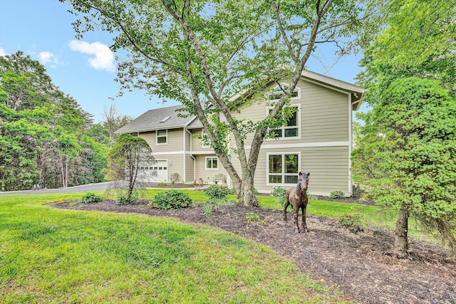 145 W Arrowhead Ct, Troutville, VA 24175 - back of property featuring a garage, a yard, and driveway