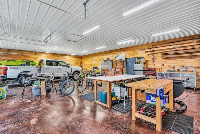 145 W Arrowhead Ct, Troutville, VA 24175 - garage with a workshop area and wooden walls