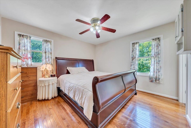 1793 Sandy Level Rd, Goodview, VA 24095 - bedroom featuring multiple windows, light wood finished floors, baseboards, and ceiling fan