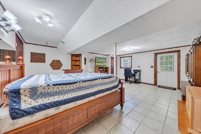 1793 Sandy Level Rd, Goodview, VA 24095 - bedroom featuring a textured ceiling, vaulted ceiling, light tile patterned floors, an office area, and baseboards