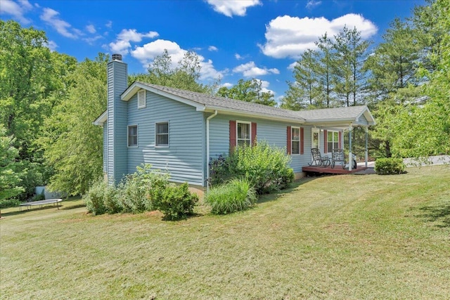 1793 Sandy Level Rd, Goodview, VA 24095 - view of side of home with a chimney and a lawn