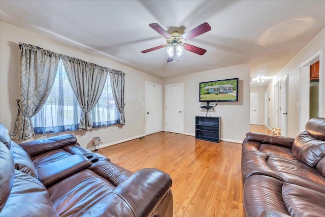 1793 Sandy Level Rd, Goodview, VA 24095 - living room featuring baseboards, ceiling fan, and light wood-style floors