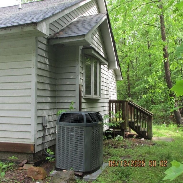 56 Craig Woods Rd, New Castle, VA 24127 - exterior view of cooling unit and a shingled roof