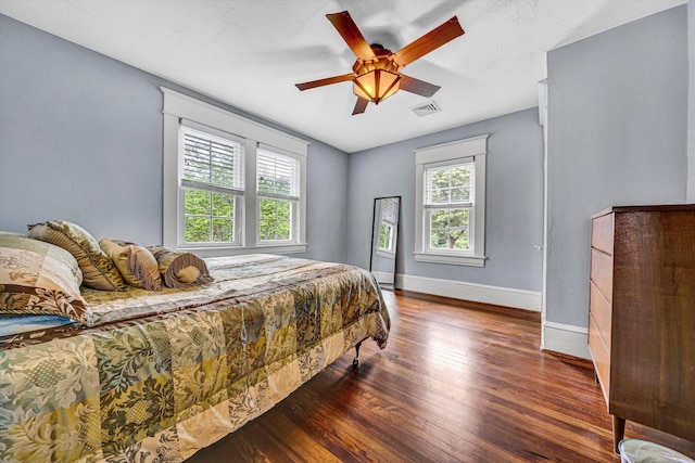 2102 Berkley Ave SW, Roanoke, VA 24015 - bedroom featuring wood finished floors, baseboards, and a ceiling fan