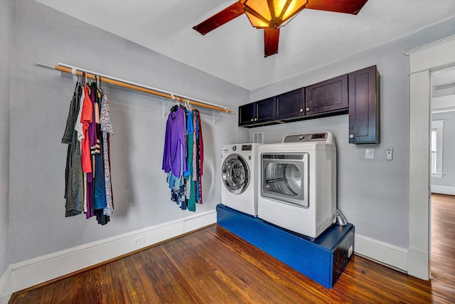 2102 Berkley Ave SW, Roanoke, VA 24015 - laundry area with baseboards, washing machine and clothes dryer, wood finished floors, cabinet space, and a ceiling fan