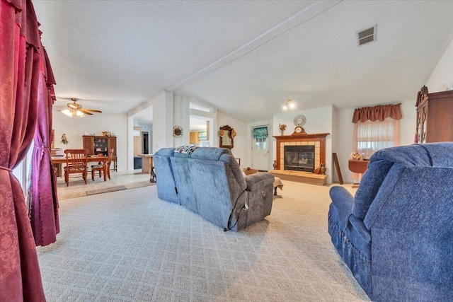 1320 Horseshoe Point Rd, Henry, VA 24102 - living room with plenty of natural light, a fireplace, lofted ceiling, a textured ceiling, and ceiling fan