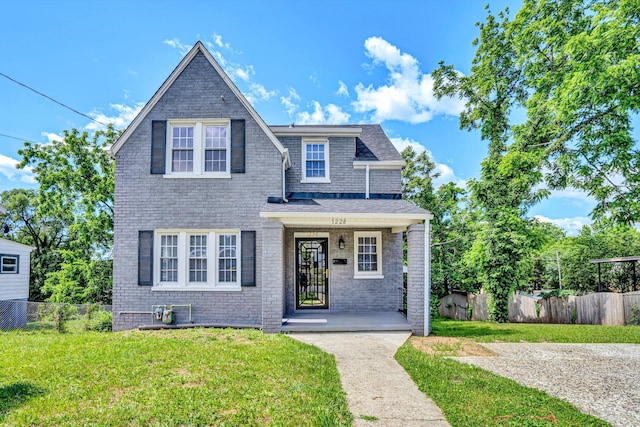 1228 Thomas Ave NW, Roanoke, VA 24017 - view of front facade with covered porch, brick siding, and roof with shingles