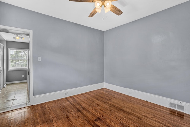 1228 Thomas Ave NW, Roanoke, VA 24017 - unfurnished room with ceiling fan, baseboards, and wood finished floors