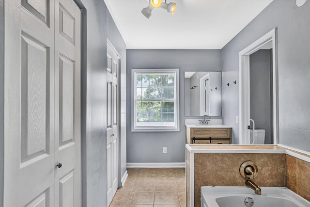 1228 Thomas Ave NW, Roanoke, VA 24017 - full bathroom featuring a garden tub, vanity, tile patterned flooring, toilet, and baseboards