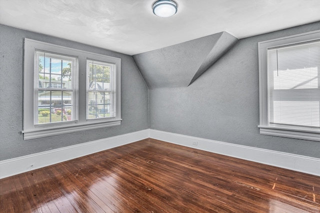 1228 Thomas Ave NW, Roanoke, VA 24017 - bonus room featuring vaulted ceiling, hardwood / wood-style floors, baseboards, and a textured wall
