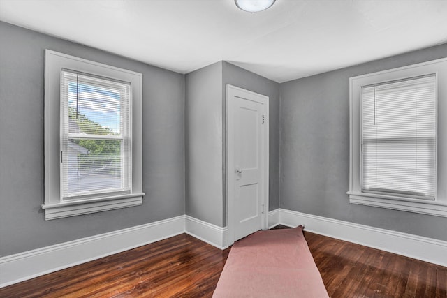 1228 Thomas Ave NW, Roanoke, VA 24017 - empty room featuring dark wood-style floors and baseboards
