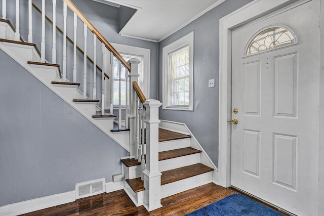 1228 Thomas Ave NW, Roanoke, VA 24017 - entrance foyer featuring wood finished floors, baseboards, crown molding, and stairway