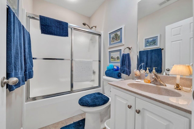 1017 Joffrey Dr, Huddleston, VA 24104 - full bath featuring tile patterned flooring, combined bath / shower with glass door, vanity, and toilet