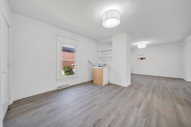 1008 Primrose St SE, Roanoke, VA 24014 - empty room featuring light wood-type flooring and baseboards