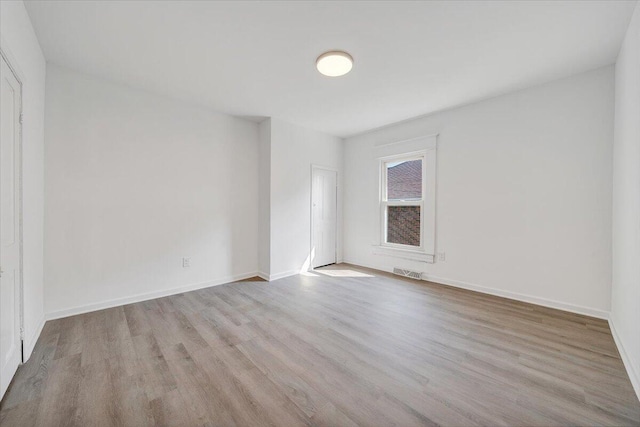 1008 Primrose St SE, Roanoke, VA 24014 - empty room featuring wood finished floors and baseboards
