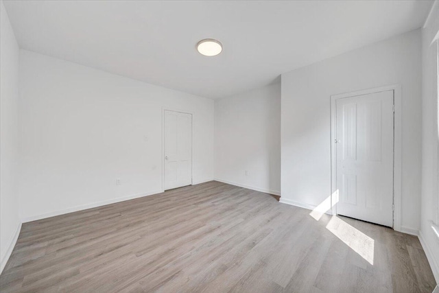 1008 Primrose St SE, Roanoke, VA 24014 - spare room featuring wood finished floors and baseboards