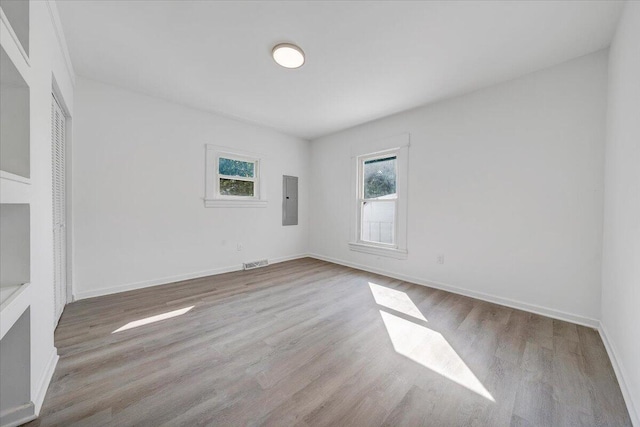 1008 Primrose St SE, Roanoke, VA 24014 - empty room featuring electric panel and wood finished floors
