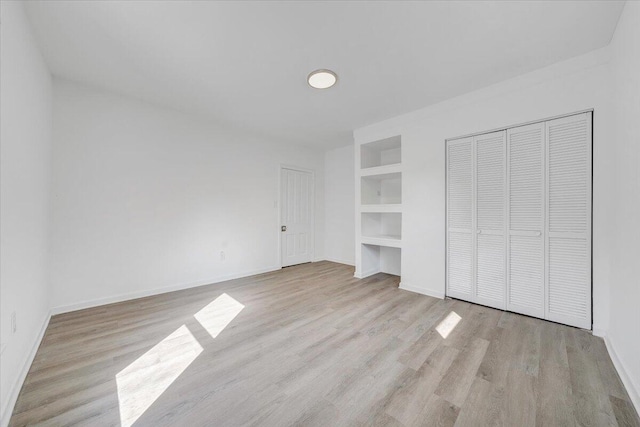 1008 Primrose St SE, Roanoke, VA 24014 - unfurnished bedroom featuring wood finished floors and baseboards