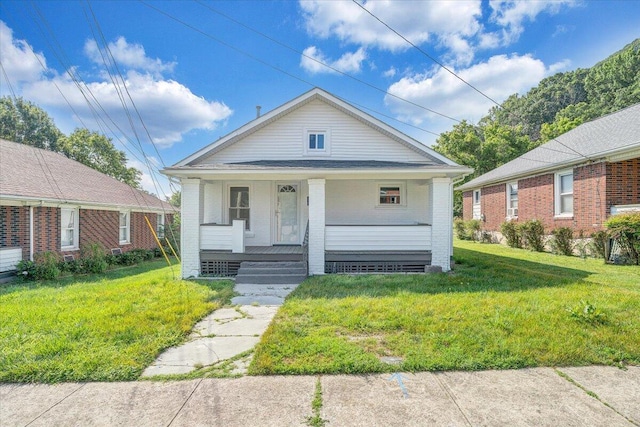 1008 Primrose St SE, Roanoke, VA 24014 - view of front of house featuring covered porch, brick siding, and a front yard