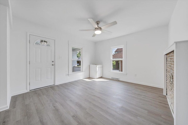 1008 Primrose St SE, Roanoke, VA 24014 - unfurnished living room featuring a ceiling fan and wood finished floors