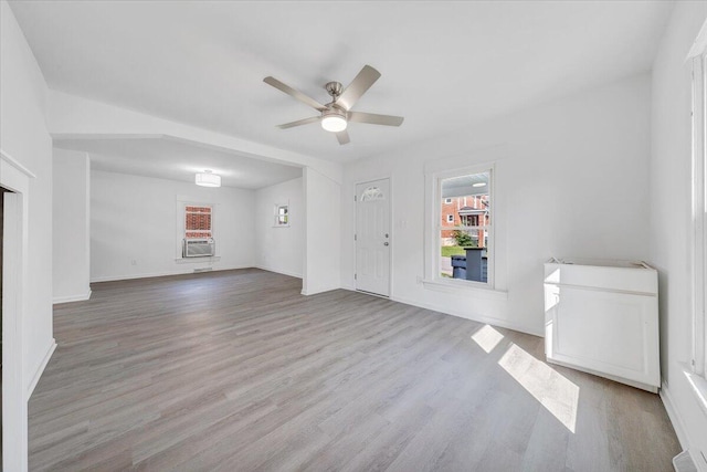 1008 Primrose St SE, Roanoke, VA 24014 - unfurnished living room with cooling unit, a ceiling fan, and wood finished floors