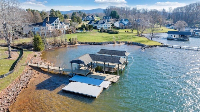 95 Shoreline Cir, Penhook, VA 24137 - dock featuring a water view, boat lift, a lawn, and a residential view