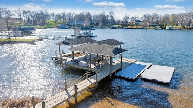 95 Shoreline Cir, Penhook, VA 24137 - dock with boat lift, a water view, and view of scattered trees