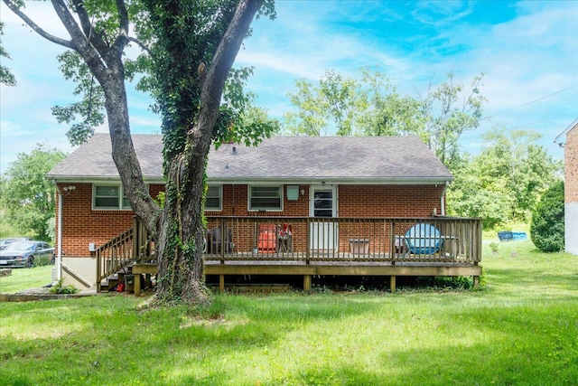 1829 Court St NW, Roanoke, VA 24012 - rear view of house featuring brick siding, a wooden deck, and a yard