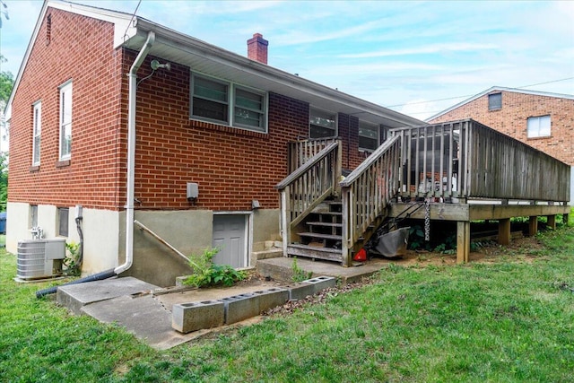 1829 Court St NW, Roanoke, VA 24012 - back of house featuring cooling unit, a yard, brick siding, a chimney, and a deck