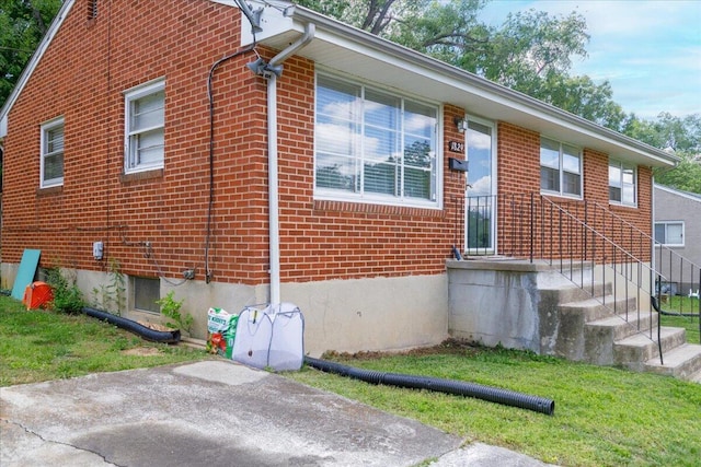1829 Court St NW, Roanoke, VA 24012 - view of side of property with brick siding and a yard