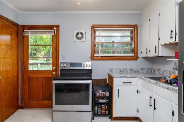 1829 Court St NW, Roanoke, VA 24012 - kitchen with stainless steel range with electric stovetop, light countertops, white cabinets, crown molding, and a sink