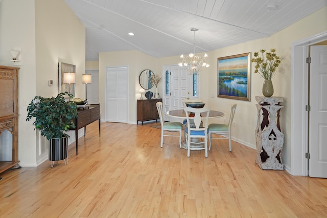 392 Carrs Point Ln, Moneta, VA 24121 - dining room featuring light wood-type flooring, a chandelier, baseboards, and lofted ceiling