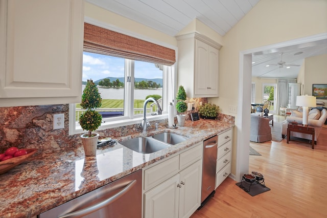 392 Carrs Point Ln, Moneta, VA 24121 - kitchen featuring stainless steel dishwasher, a sink, light wood-type flooring, light stone counters, and a ceiling fan