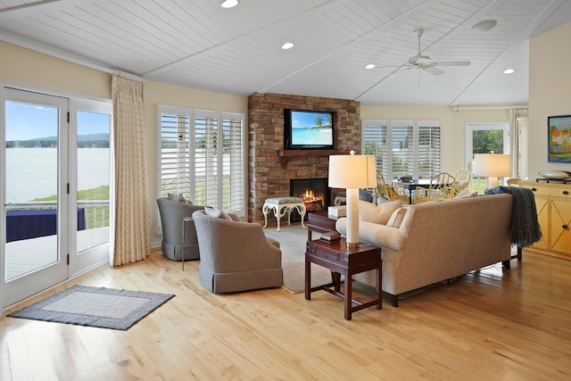 392 Carrs Point Ln, Moneta, VA 24121 - living area featuring a stone fireplace, plenty of natural light, light wood-style floors, a ceiling fan, and recessed lighting