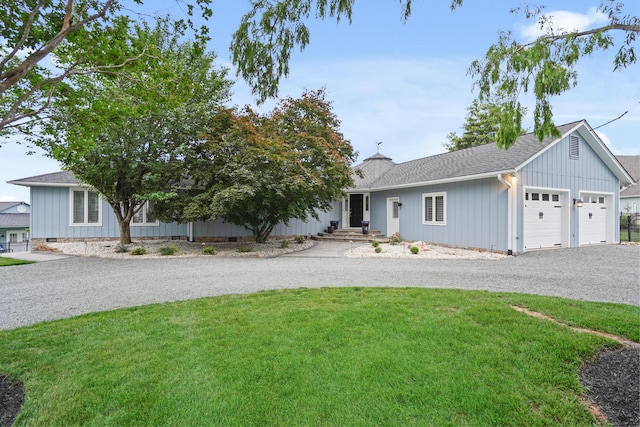 392 Carrs Point Ln, Moneta, VA 24121 - view of front facade featuring a front yard, gravel driveway, a garage, roof with shingles, and a chimney
