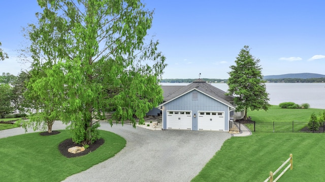 392 Carrs Point Ln, Moneta, VA 24121 - view of front of home featuring board and batten siding, driveway, and a water view