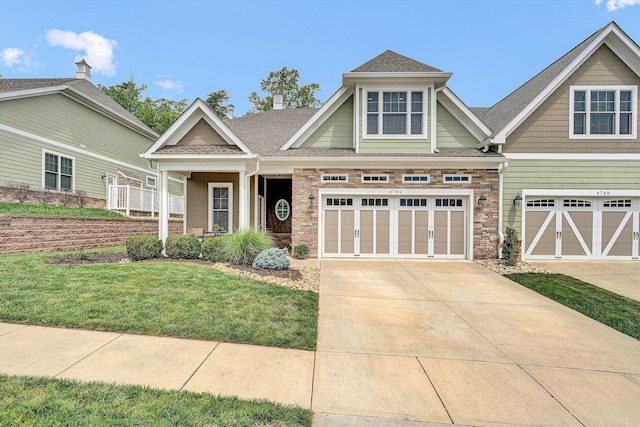 4742 Leigh Ln, Roanoke, VA 24018 - craftsman house with driveway, a garage, a front lawn, and roof with shingles